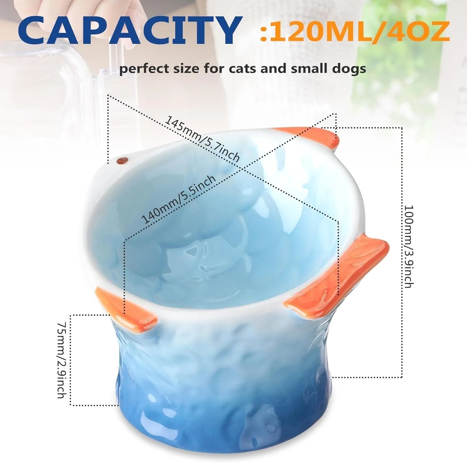 Blue fish-shaped ceramic cat bowl with tilted angle on a wooden surface