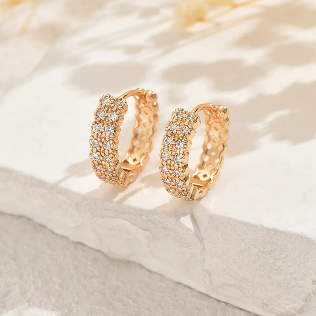 Copper geometry pattern ear studs with round, dot, and ring design elements, colour DE20288.