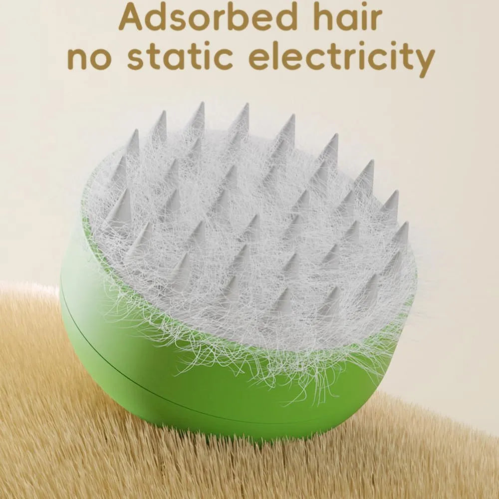 Green and yellow rechargeable steam brush for grooming cats and dogs on a white background.