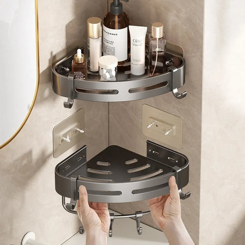 Gun grey metal triangle corner shelf mounted on a bathroom wall for shower storage.