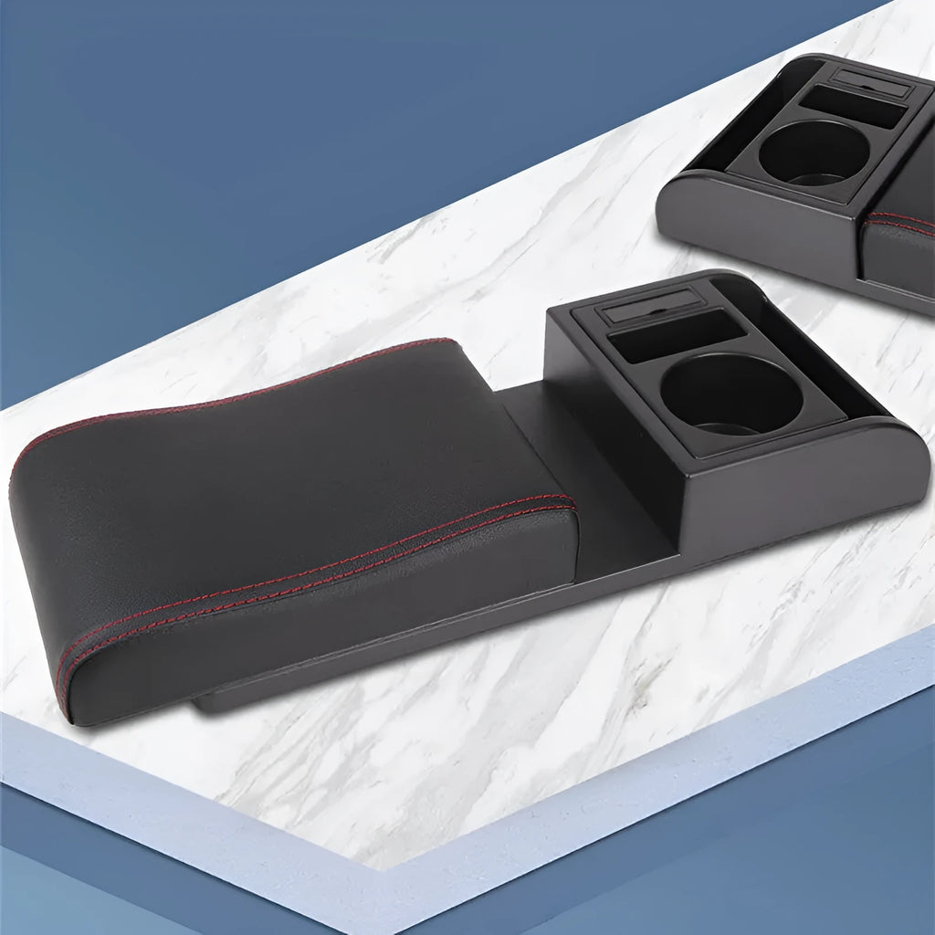 Universal plastic car armrest cover in PU leather black with red accent lines, shown on a centre console.
