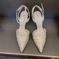 Women's black hollow high heel court shoe with red sole and pointed toe, stiletto heel.