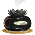 Pure black round ultrasonic aromatherapy humidifier with USB cable for power.