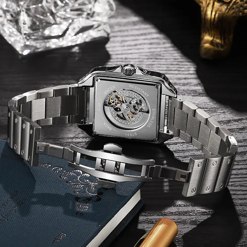 Men's square-faced automatic watch with diamond studs on a black leather strap
