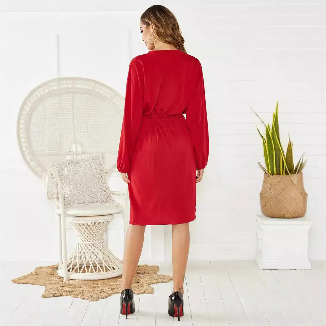 Women's solid colour A-line midi dress with long sleeves and an elastic waistband with a belt.