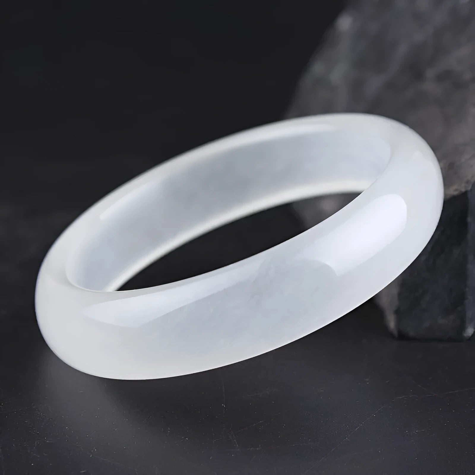 Gao bing jade bracelet in ice-white with flat rod and round rod style options on a wrist