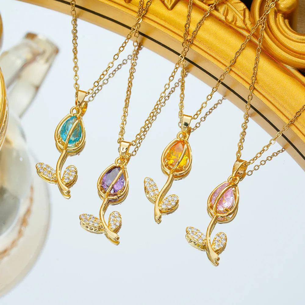Zircon tulip flower pendant necklace for women in gold colour on an adjustable O-ring chain.