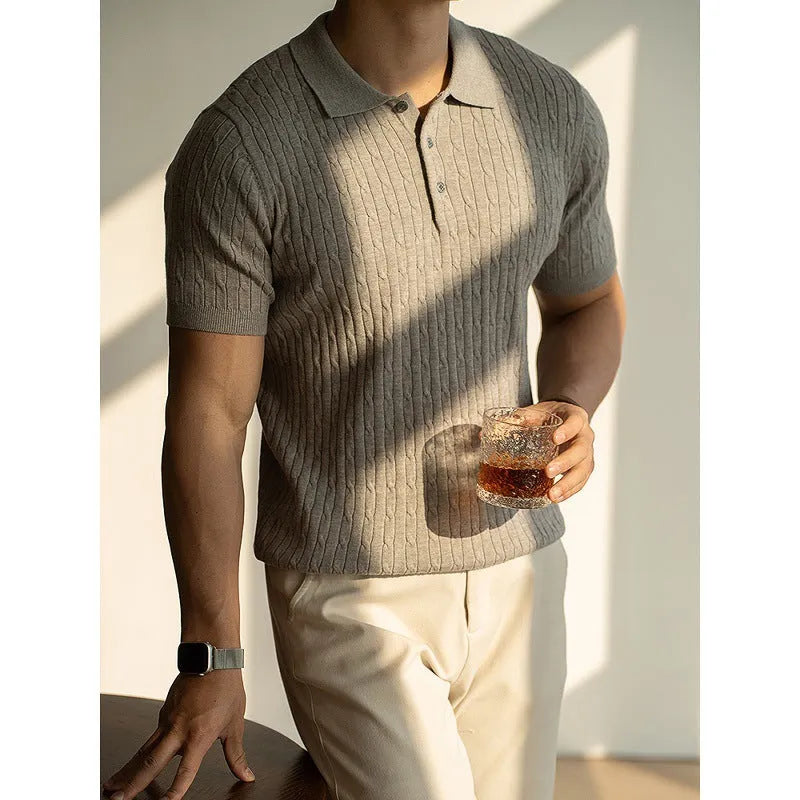 Men's khaki short sleeve business top laid flat, showing collar and button detail.