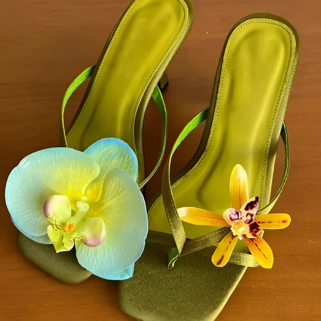 Handmade women's high-heel sandals with an asymmetric flower design on a calf leather upper.