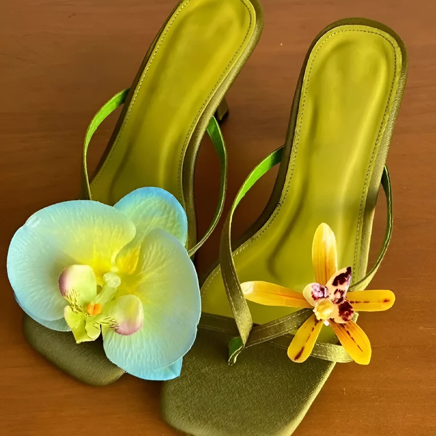 Handmade women's high-heel sandals with an asymmetric flower design on a calf leather upper.