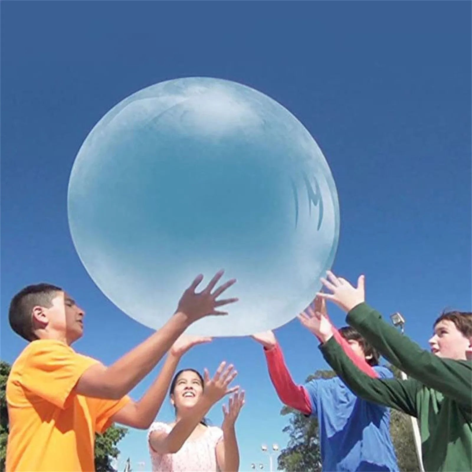 Large pink inflatable bubble ball on grass, showing its size and smooth TPR surface.