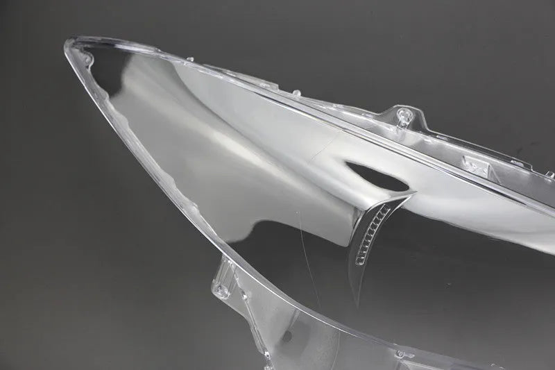 Mazda 3 Exela large headlamp cover replacement part with tube of snake glue adhesive.
