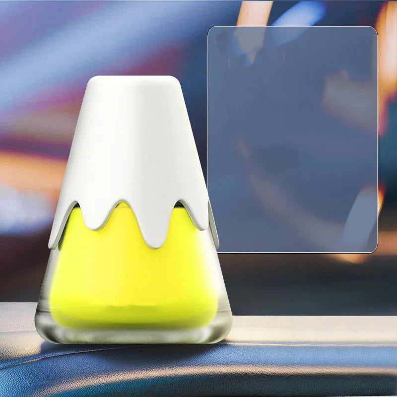 Glass cup car aromatherapy diffuser showing purple, lime, laurel, and blue colour options on a car dashboard.