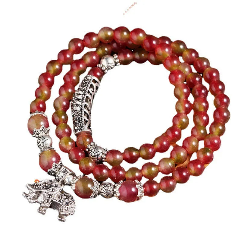 Handmade watermelon crystal bracelet with Chinese knot and geometric beads in 6mm or 8mm sizes.
