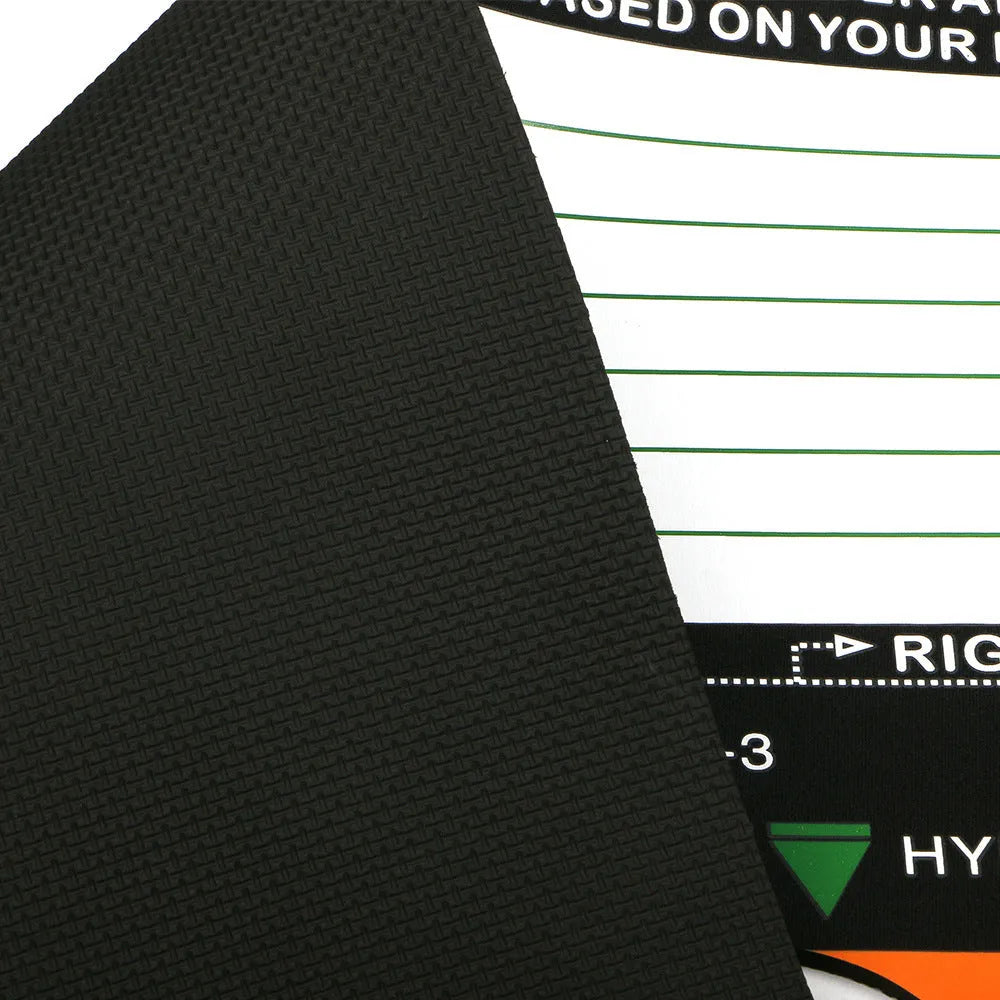 Black neoprene golf swing stance training pad on a green surface.