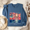 Blue plus size drop-shoulder printed pullover sweater on a hanger