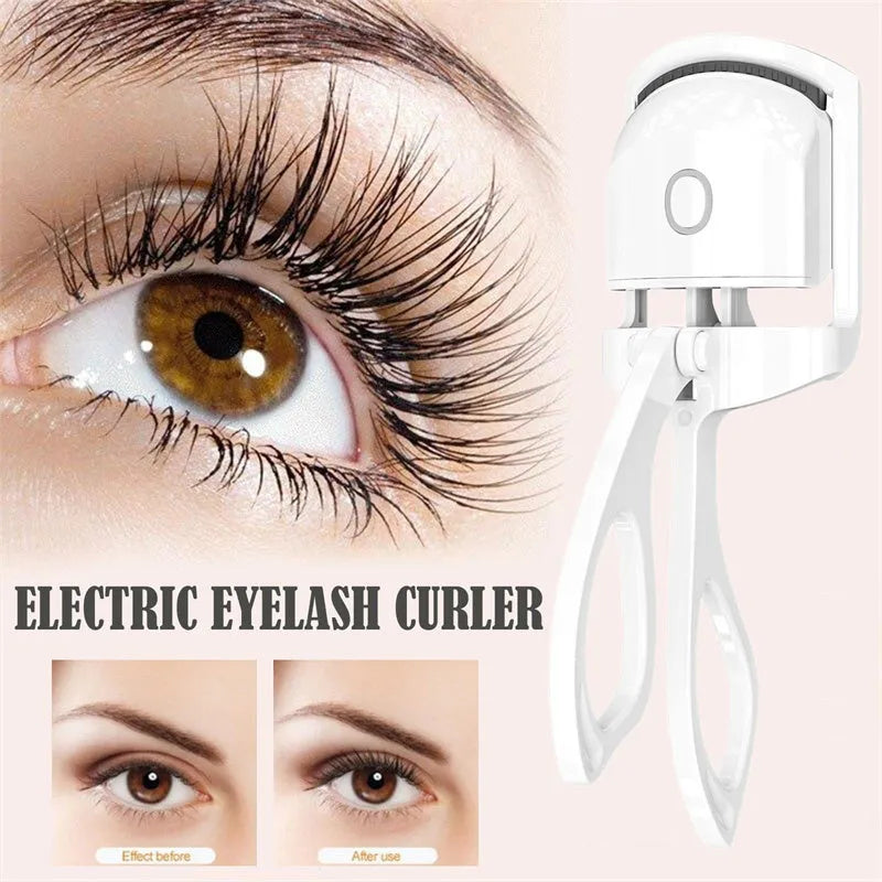 White USB rechargeable heated eyelash curler with dual temperature lights, shown next to its charging cable.