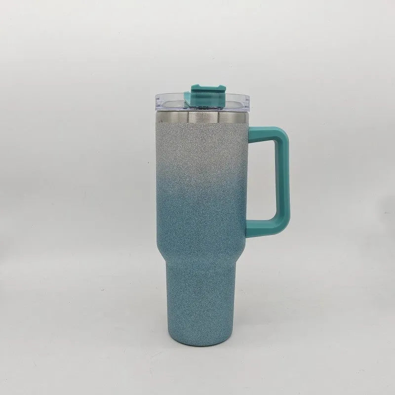 Large stainless steel vacuum insulation cup in a gradient colour, showing double-wall construction and 27.5cm height.