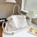 Large soft black PU messenger tote bag with shoulder strap and top zipper