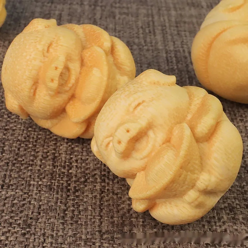 Solid bamboo pig carving ornament measuring 4cm height with 3.5cm diameter ingot shape