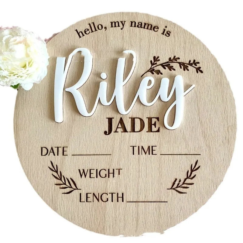 Square wooden name plaque engraved with newborn birth details for nursery wall display