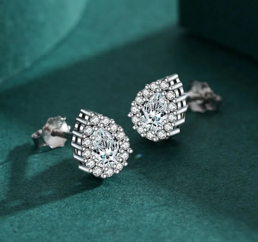 Women's silver water drop ear studs with diamond treatment and 925 sterling silver construction