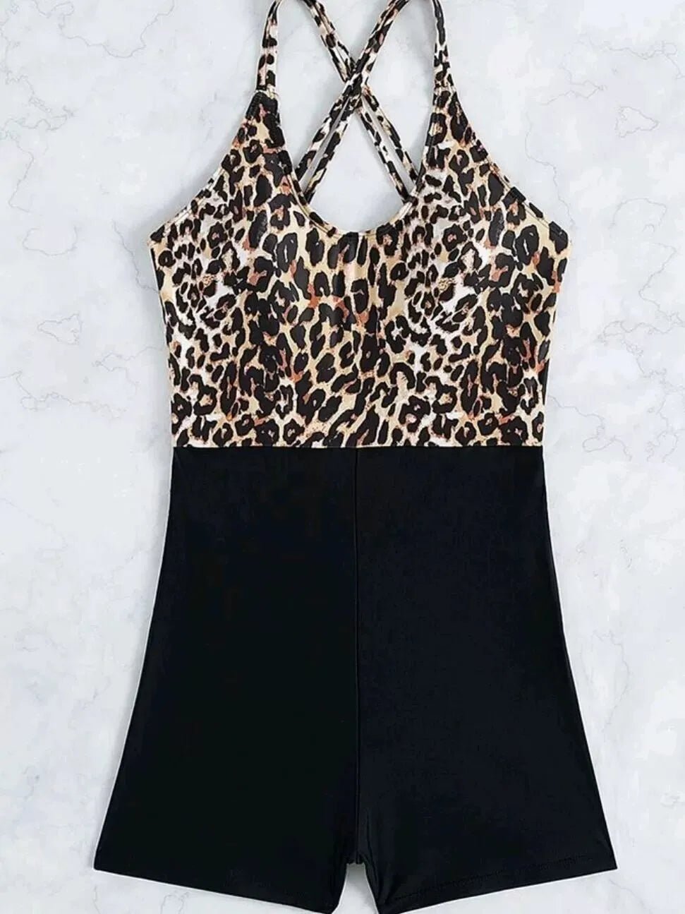 Women's one-piece swimsuit with leopard print, cross lace-up front, and slimming hip design
