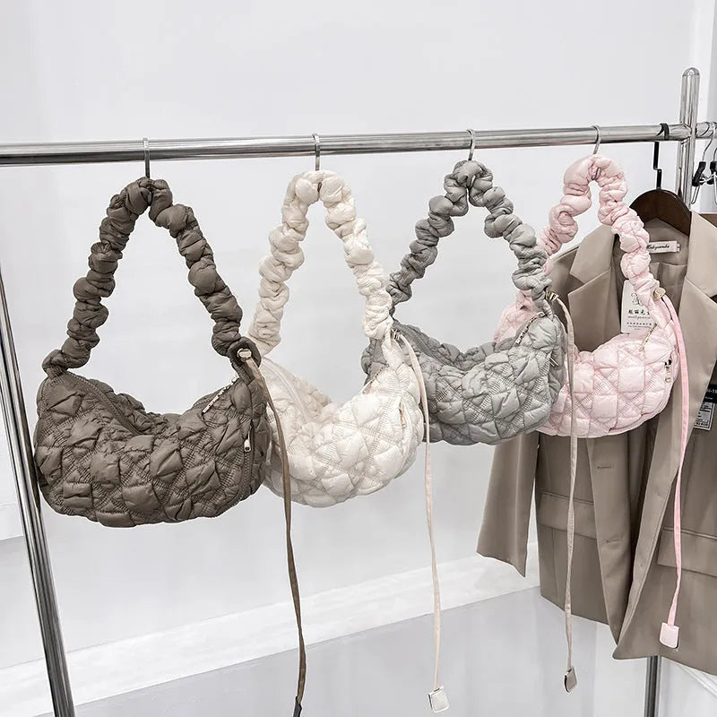 Women's nylon underarm shoulder bag in beige colour showing front view with adjustable strap