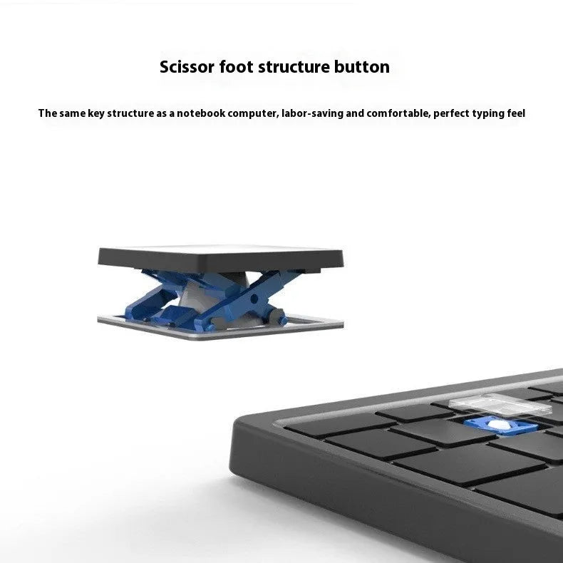 Black and grey wireless Bluetooth keyboard with touch pad next to its leather sheath stand for a tablet.