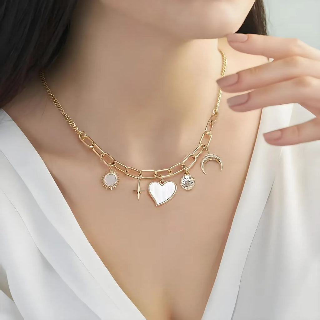Gold alloy pendant necklace with moon inlaid heart-shaped and star-shaped zircon on a bamboo chain