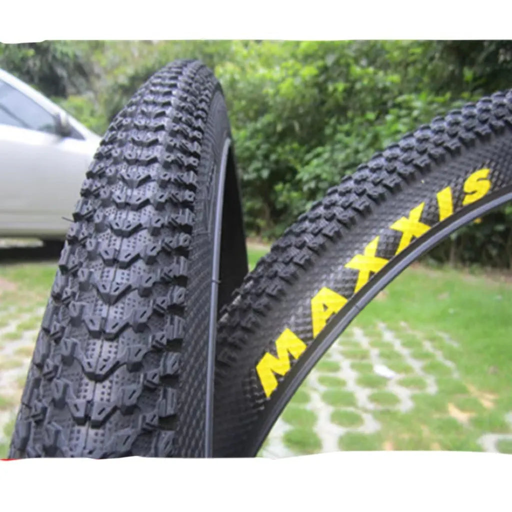Ultralight puncture-proof mountain bike tyre showing tread and available size options: 26, 27.5, 29 inch.
