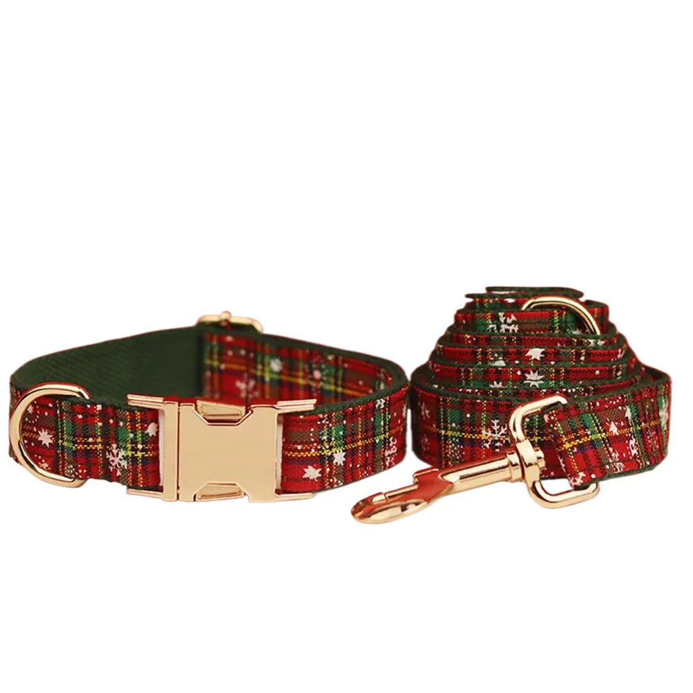 Green fabric Christmas pet collar and leash set with snowflake pattern, including a vest and decorative bow.