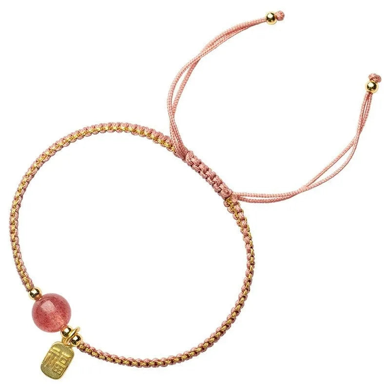 Adjustable red rope bracelet with sliding strawberry quartz bead in national tide style.