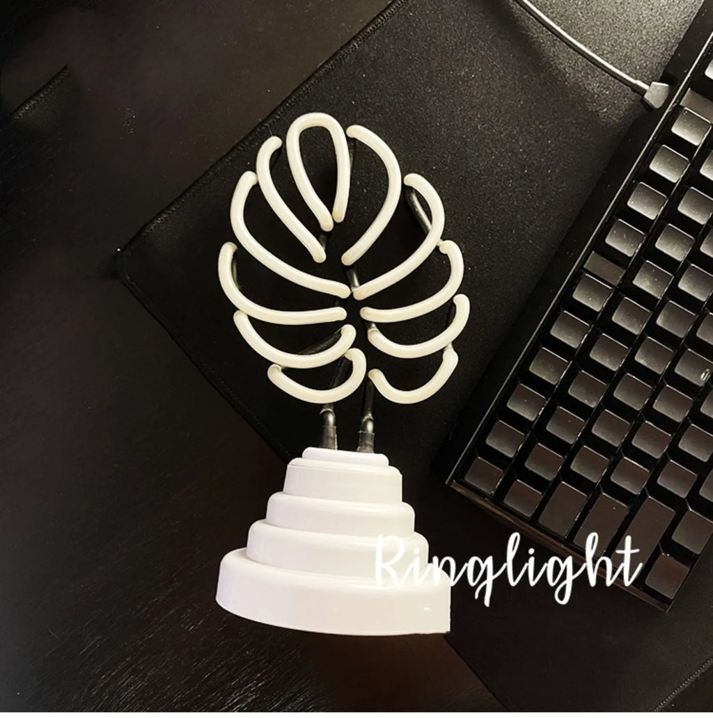 Handmade bamboo-shaped white and green USB desktop lamp in two sizes.