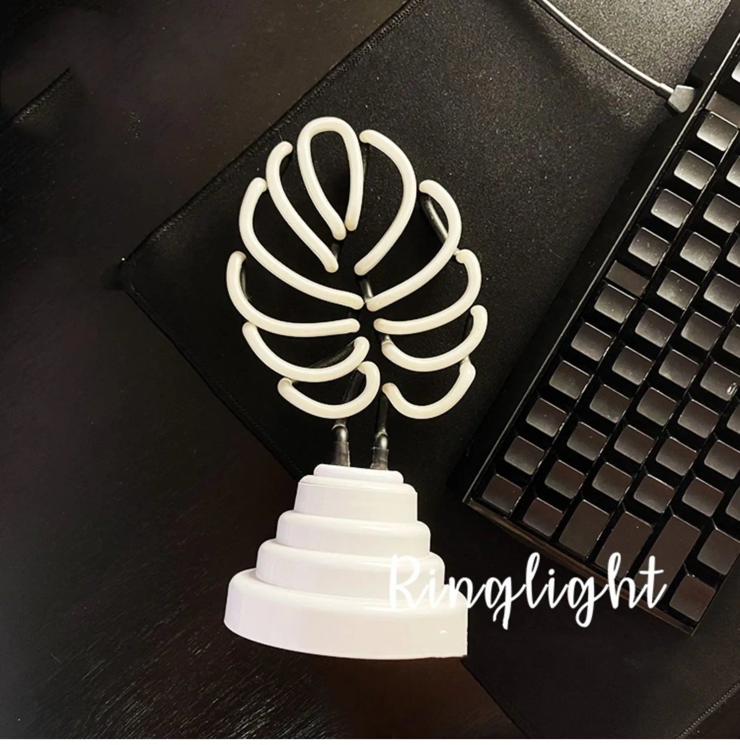 Handmade bamboo-shaped white and green USB desktop lamp in two sizes.