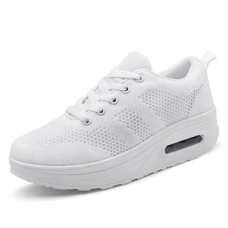 Women's platform casual shoes in black with a flyknit upper, T-shaped strap, and vulcanised sole.