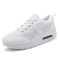 Women's platform casual shoes in black with a flyknit upper, T-shaped strap, and vulcanised sole.