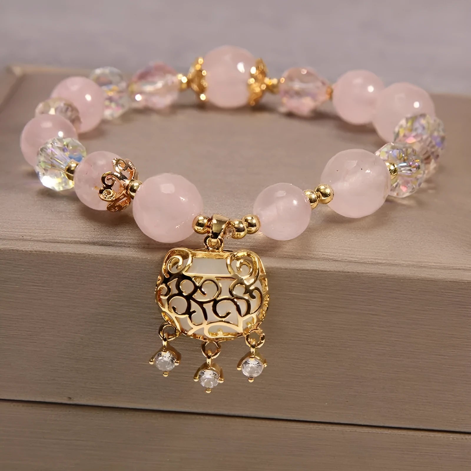 Yellow agate crystal bracelet with gold silk cord on wrist showing adjustable closure and bead detail