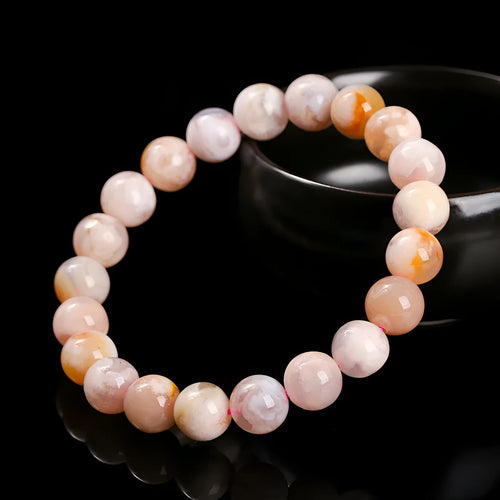 A sweet-style natural cherry agate bracelet with round geometric beads for women.