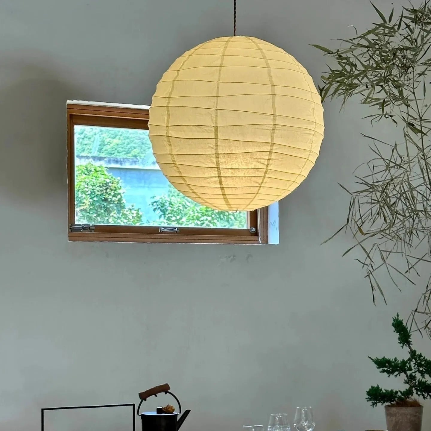 Japanese rice paper chandelier in living room setting showing soft ambient lighting
