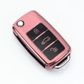 VW Model A car key case buckle set in silver, blue, pink, and red colours, showing TPU material and folding key design.