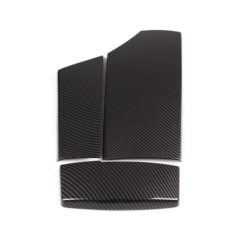 Three ABS carbon fibre pattern armrest box protective covers showing diagonal weave and shiny surface