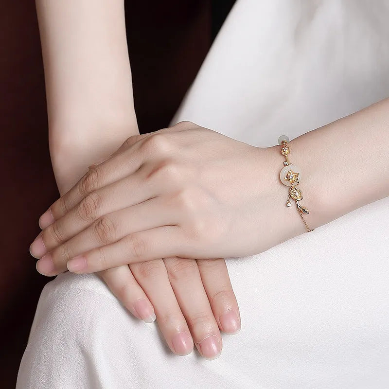 Hetian jade and 925 silver peace buckle bracelet for women in retro style.