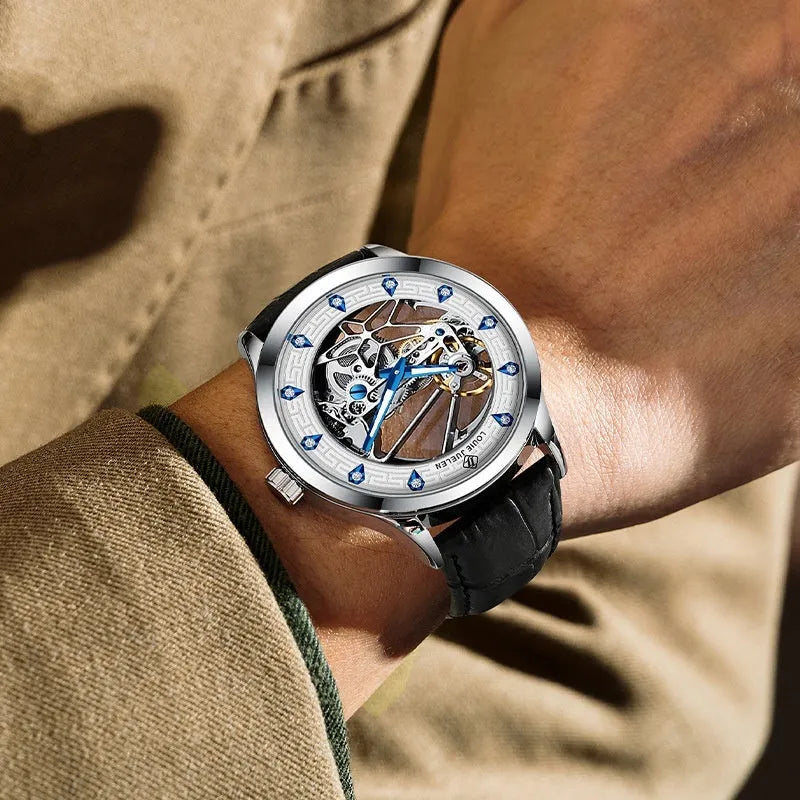 Men's silver case mechanical watch with white dial, blue hands, and black leather strap.
