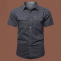 Men's short sleeve cotton work shirt in a loose cardigan style, shown in a selection of colours.