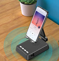 Black Bluetooth speaker phone stand with microphone for live streaming, showing phone holder and charging port