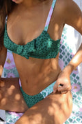Green polka dot bikini two-piece swimsuit with retro pattern and brief style design