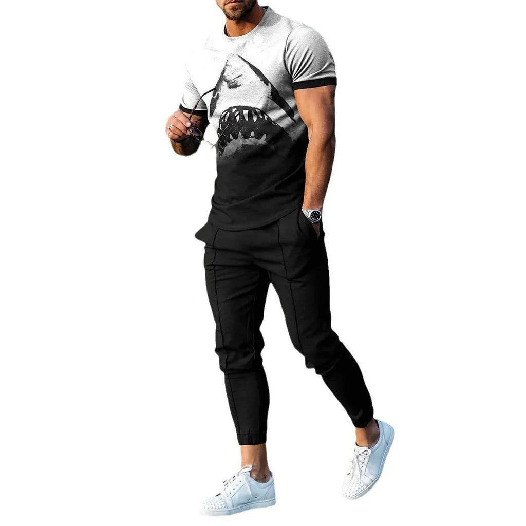 Man wearing a thin, short-sleeved printed pullover and matching trousers from a polyester blend sport suit set.