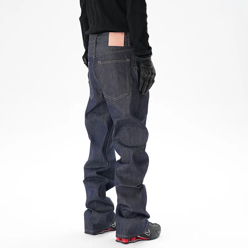 A pair of dark blue casual loose straight-cut jeans on a plain background.