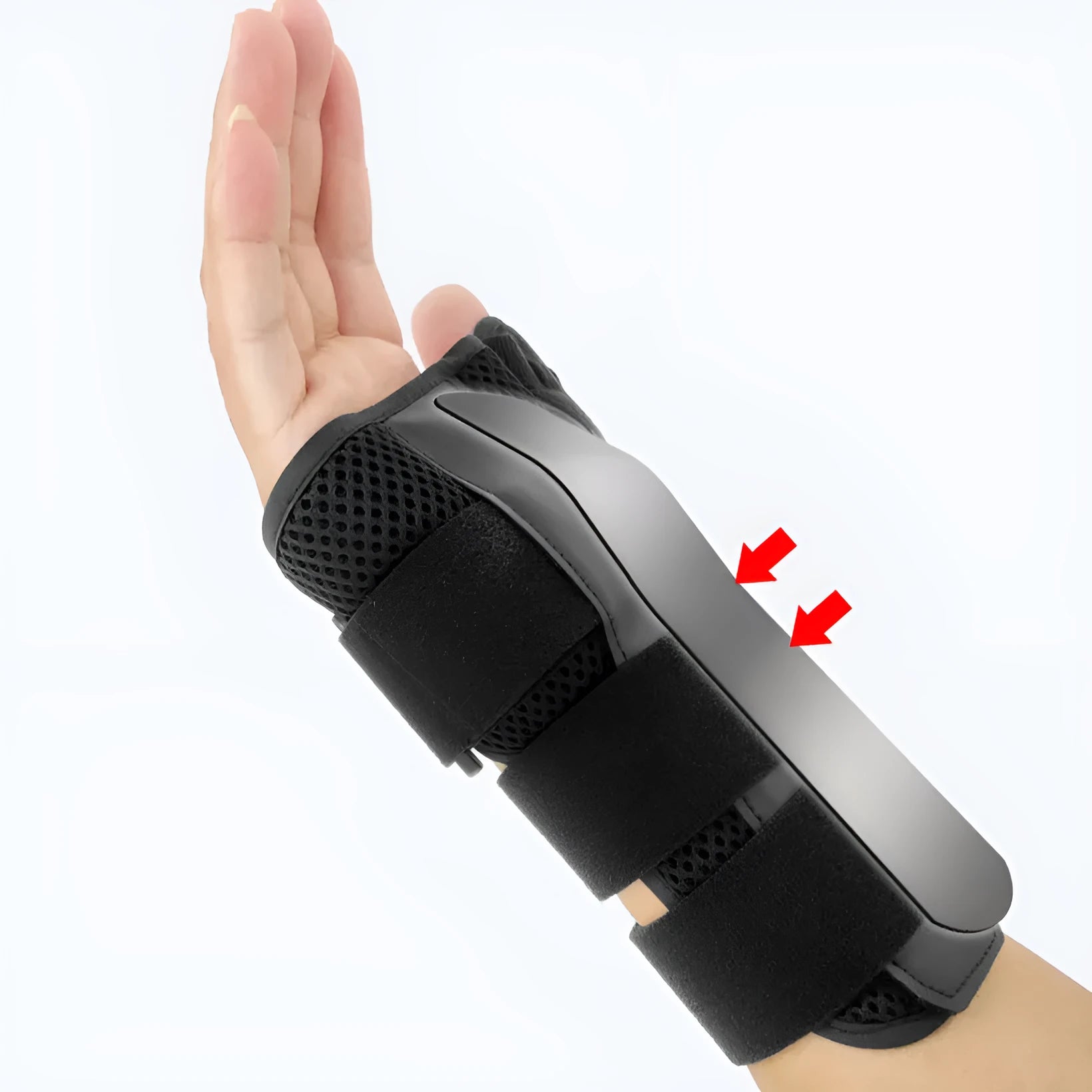 Carbon fibre sports wrist guard with thumb strap in black and grey, shown on a hand.